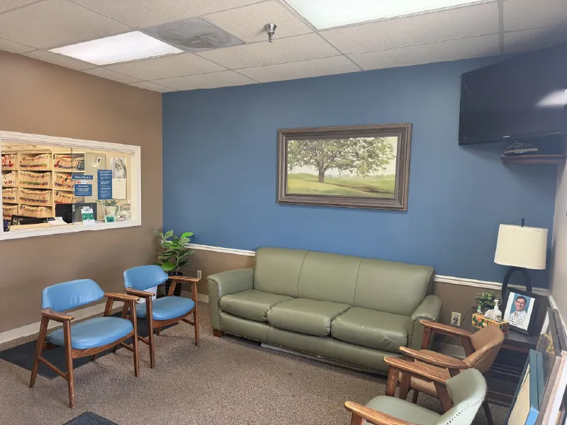Waiting area with sofa and artwork